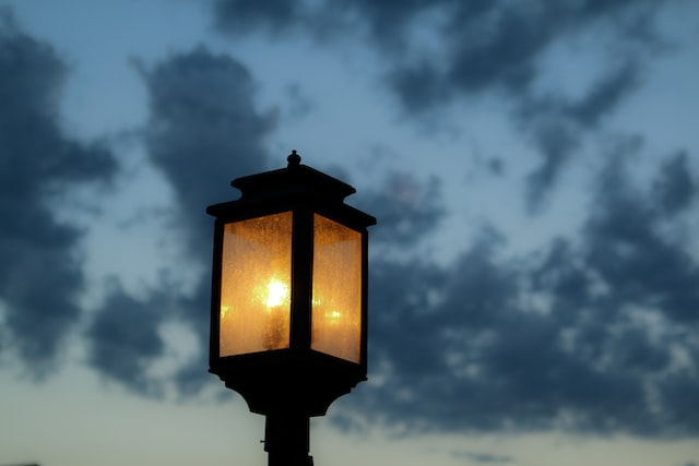 front porch light on as the sun is setting