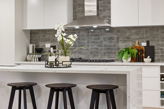 modern kitchen with tall black stools